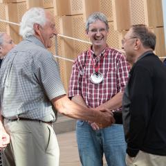 Reunion attendees greet each other in the atrium