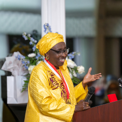 Salmon Award recipient at the podium gesturing
