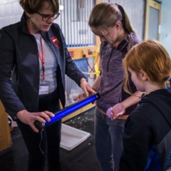 Doctor showing guests how a black light is used