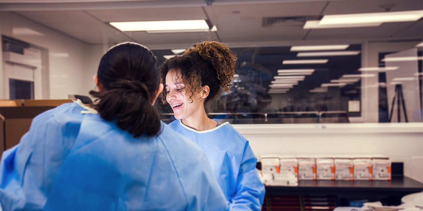 Participants in the Daver Lab working at a medical table