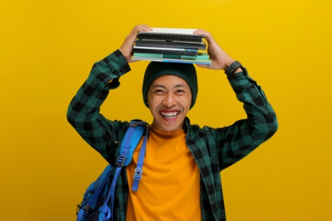 A student holding books