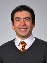 A professional portrait image of Dr. Ken Cadwell.