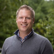 A professional portrait image of Dr. Mark Sundrud.