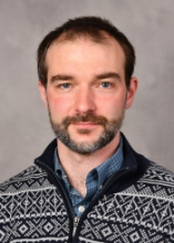 A professional portrait image of Dr. Adam Waickman.