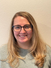 A professional portrait image of Dr. Jenn Guthmiller.