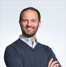 A professional portrait image of Dr. James Munro.