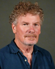 A professional portrait image of Dr. Colin Parrish.