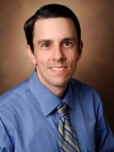 A professional portrait image of Dr. Scott Smith.