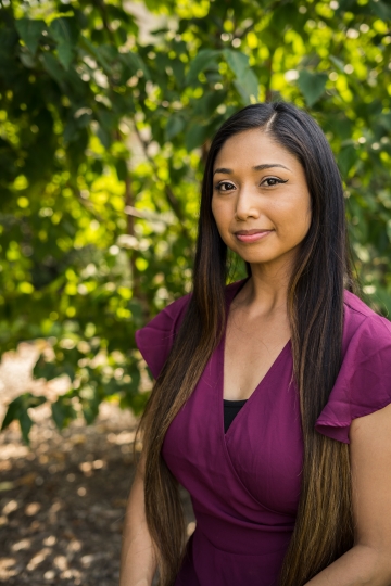 Paula Banuelos, women in purple shirt with long hair
