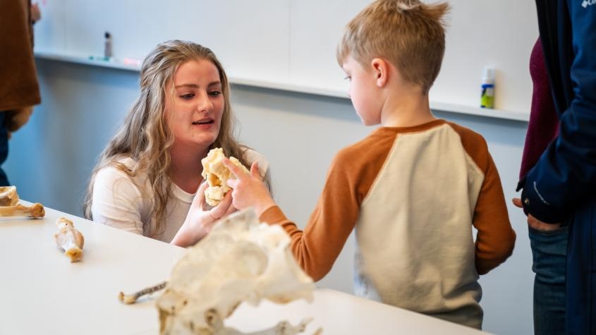 A veterinarian talking to a child