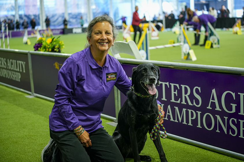 Liz Dole with dog near agility arena