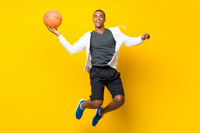 A man throwing a basket ball