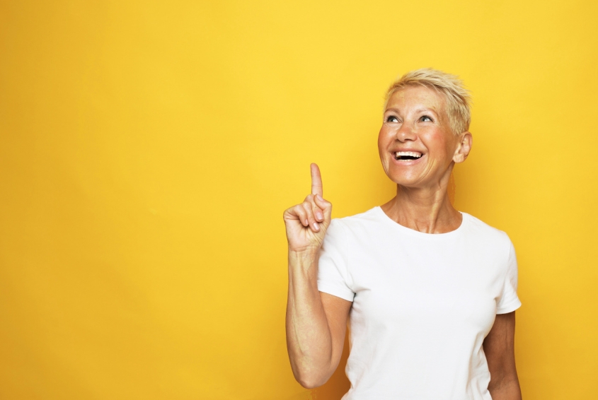A woman pointing up