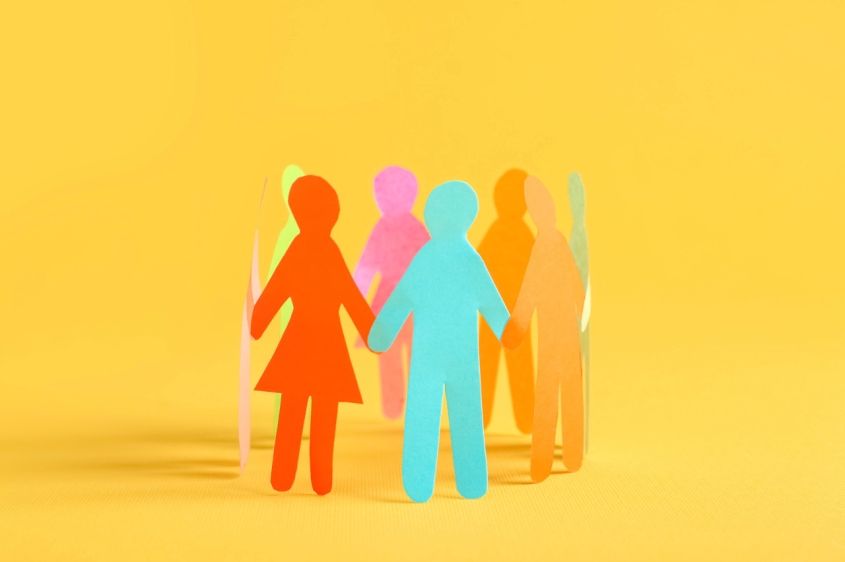 Paper human figures standing in circle