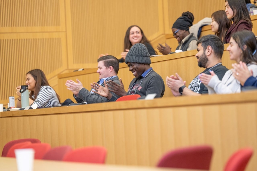 Audience clapping in CVM lecture hall
