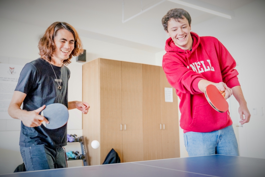 Two people playing ping-pong