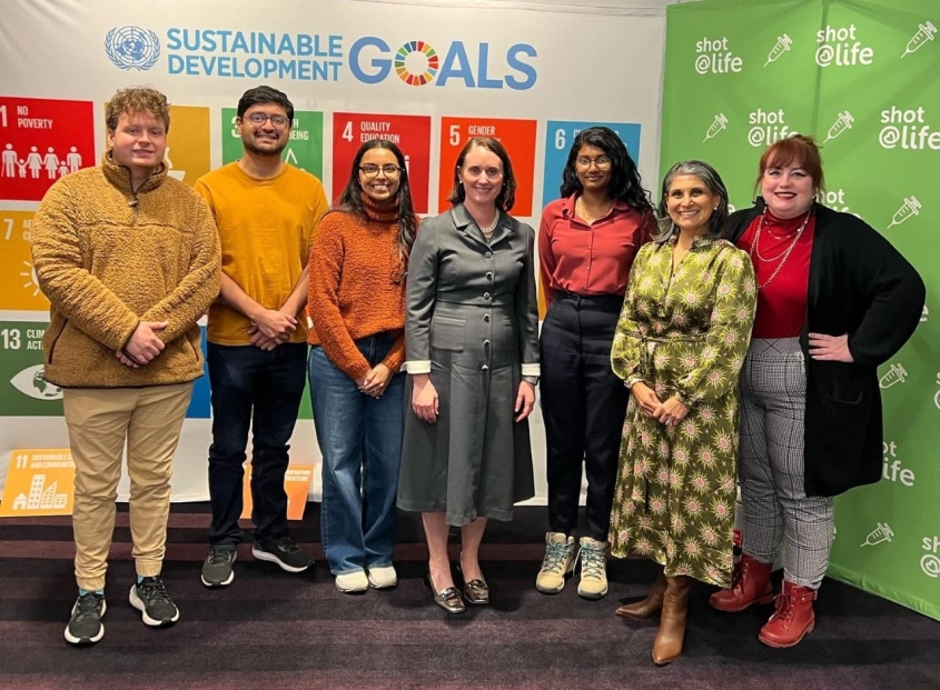 A group of students and staff posing together