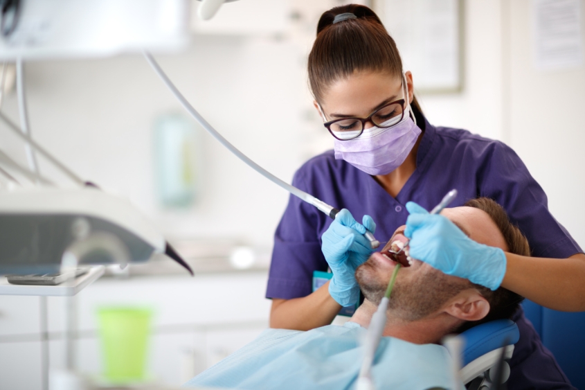 a dentist treating a patient