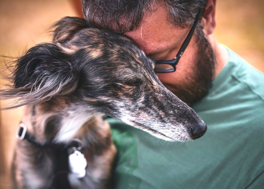Man hugging his dog