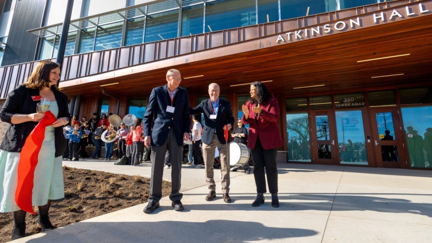 Cornell president and vice provost standing in front of atkinson hall