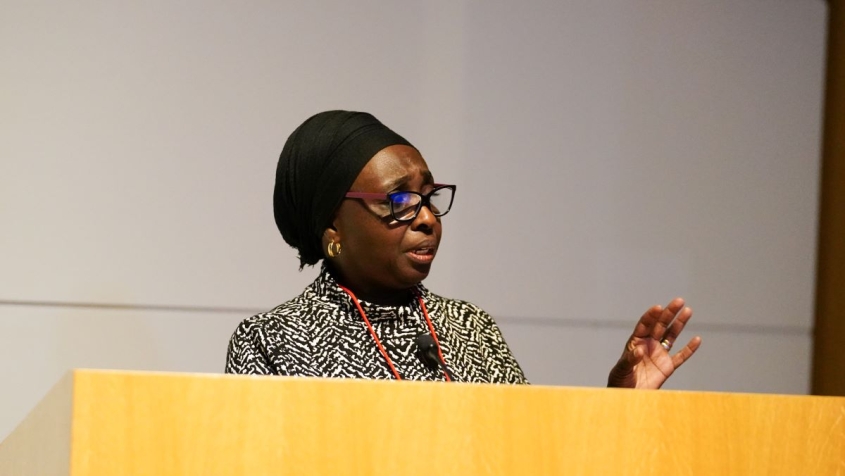 Jarra Jagne speaking at a podium