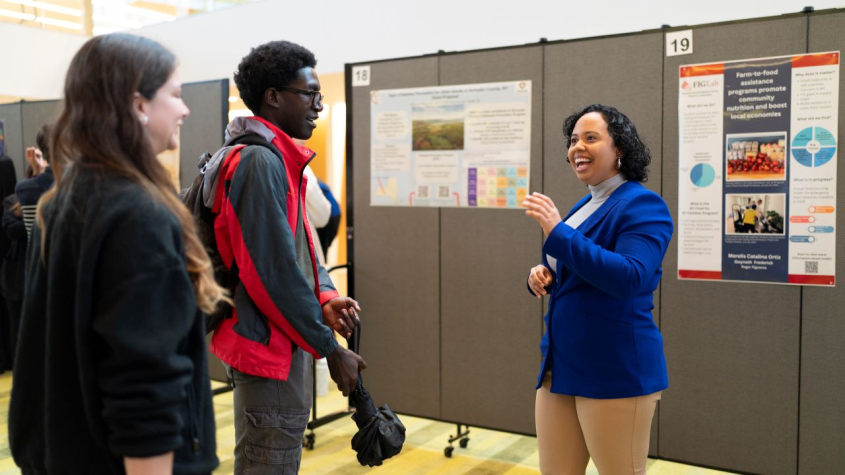 students discussion at a poster session
