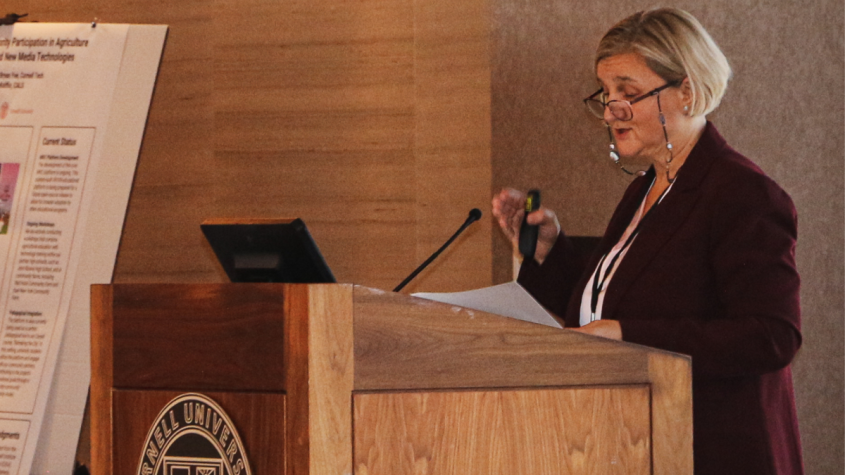 Renata Ivanek at a podium