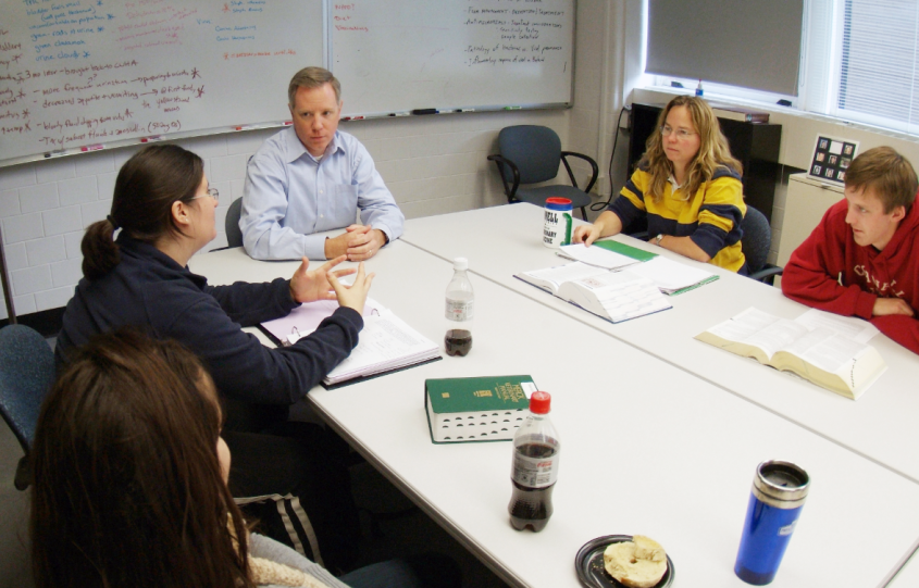 People chatting around a meeting table