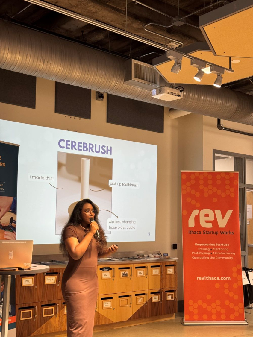 Meghana presenting Cerebrush on stage