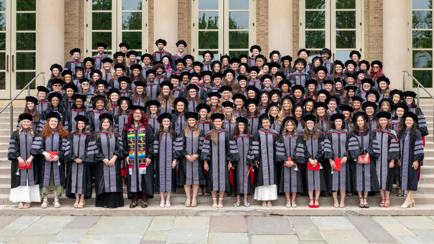 CVM Class of 2026 posing in front of Bailey Hall