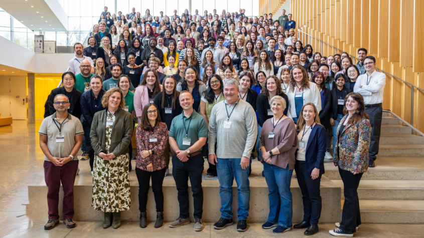 Group of researchers posing in the atrium