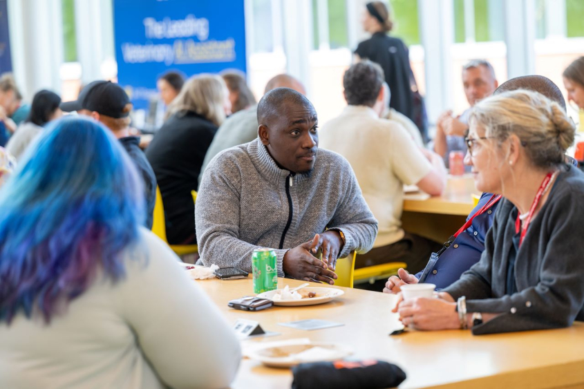 people talking at a table