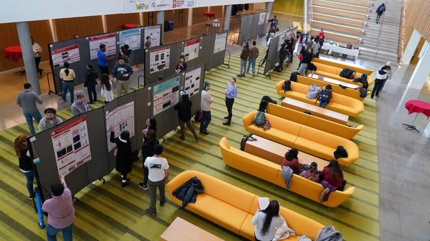 Students presenting posters in the CVM Atrium