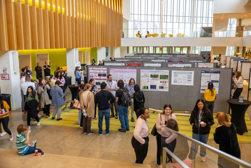 Students presenting posters in the CVM Atrium