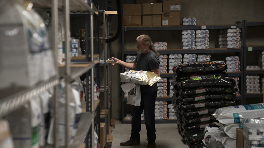 A staff member checks inventory