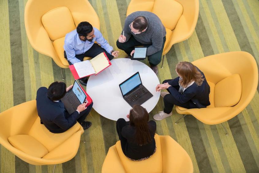 A group of MPH students gather informally in the CVM atrium in 2018