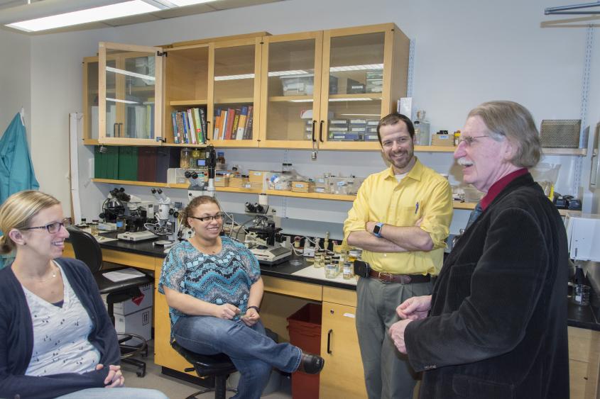 Students in the MPS program talk with Director Dr. Dwight Bowman