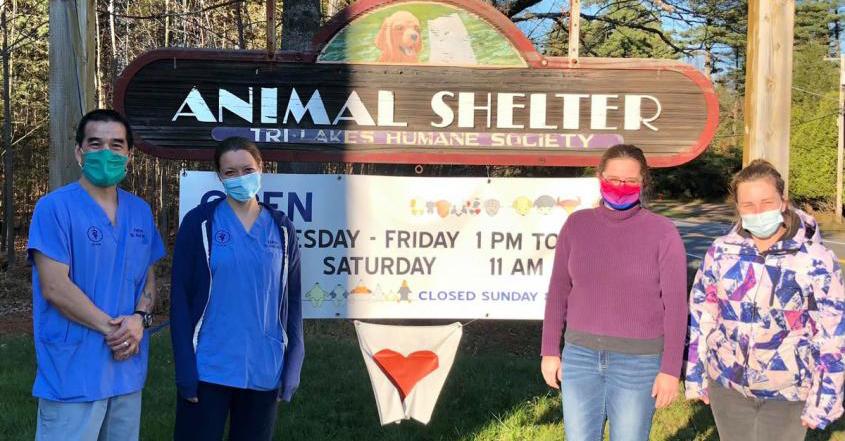 The FARVets team poses in front of the Tri-Lakes Humane Society Animal Shelter sign