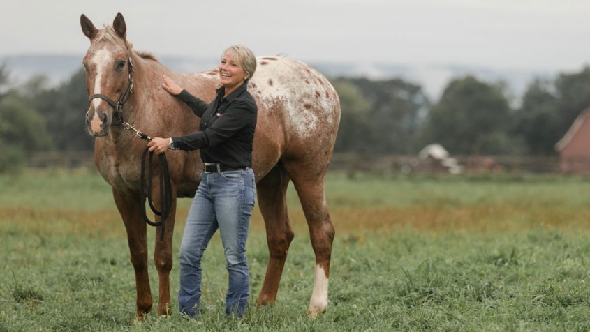Lisa Fortier with a horse at the Cornell Equine Park