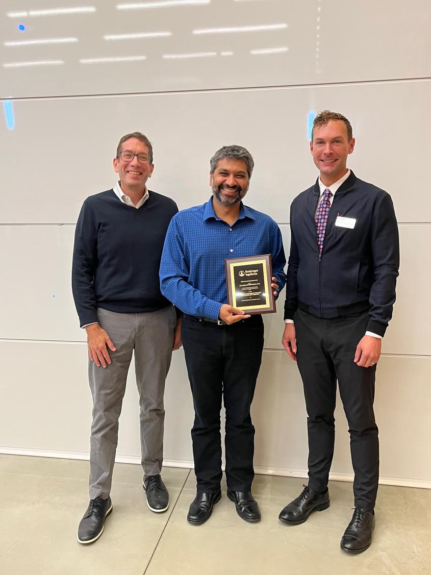 Image of 2022 BI Mentoring Award recipient Praveen Sethupathy w/ Award presenters