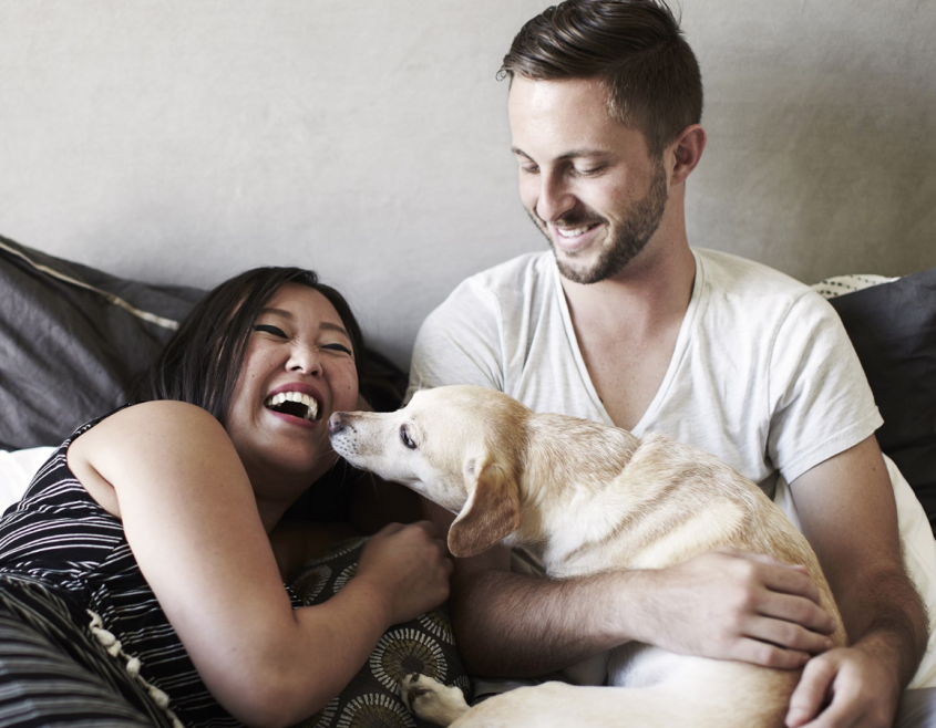 People playing with dog