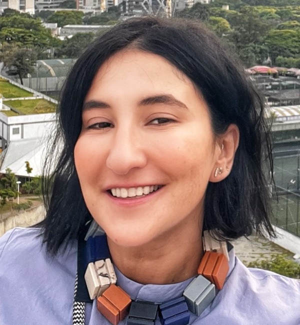 Ana Bento wearing a lavender shirt.