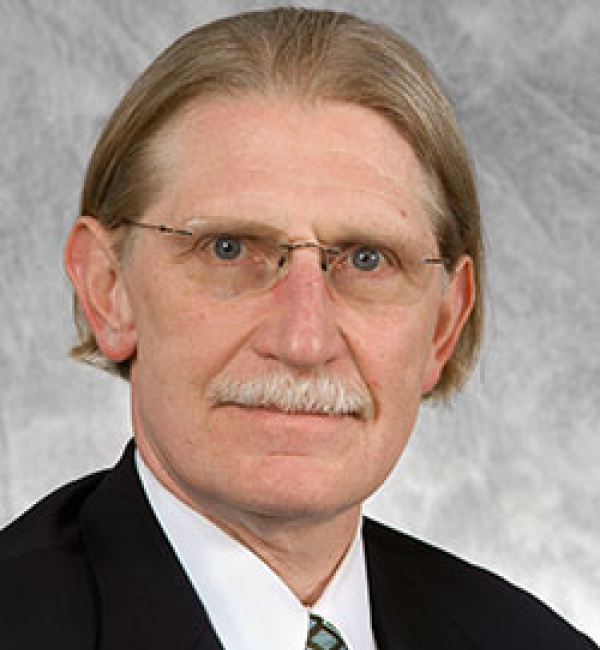 A headshot of Dr. Dwight Bowman, Veterinary Parasitologist.