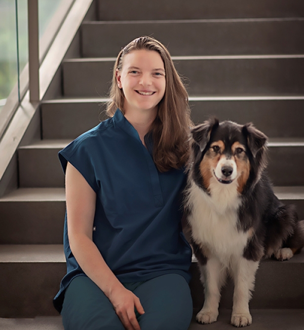 Dr. Margret Lenfest seated with a dog