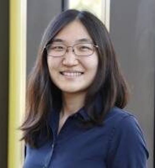 Jennifer Sun wearing a navy blue button-up.