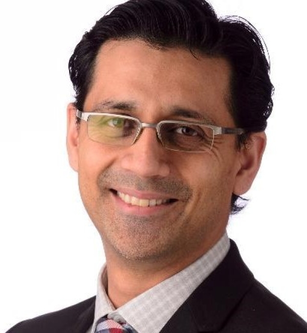 Parminder Basran in a suit.