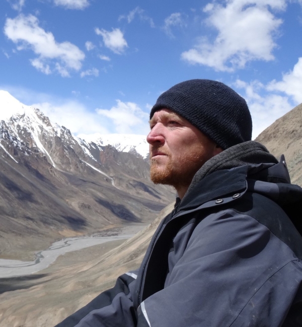 Martin Gilbert looking outwards at the mountains.