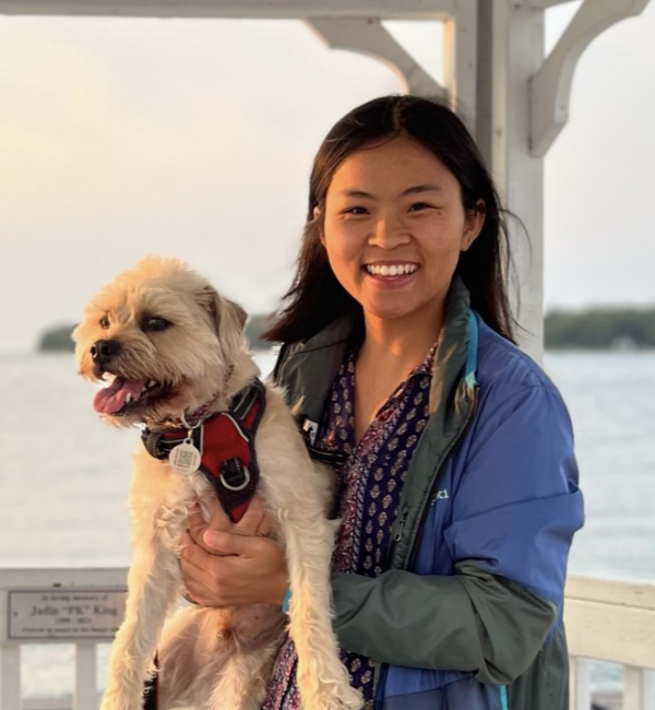 Amy Huynh with a white dog