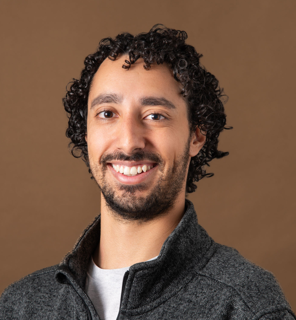 Pablo Cárdenas Ramírez smiling in gray cardigan 
