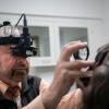 Dr. Thomas Kern performing an eye examination